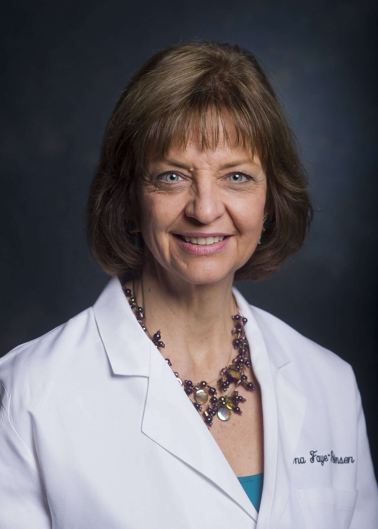 Head shot of Dr. Ona Faye-Petersen, MD (Professor, Anatomic Pathology) in white medical jacket (2013).