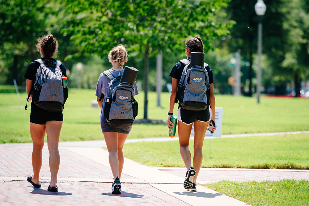 UAB female students walking away