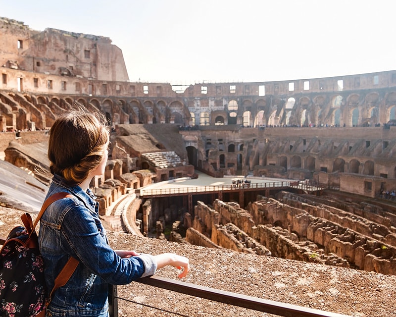 A student looking out over the ruins of the Colliseum. 