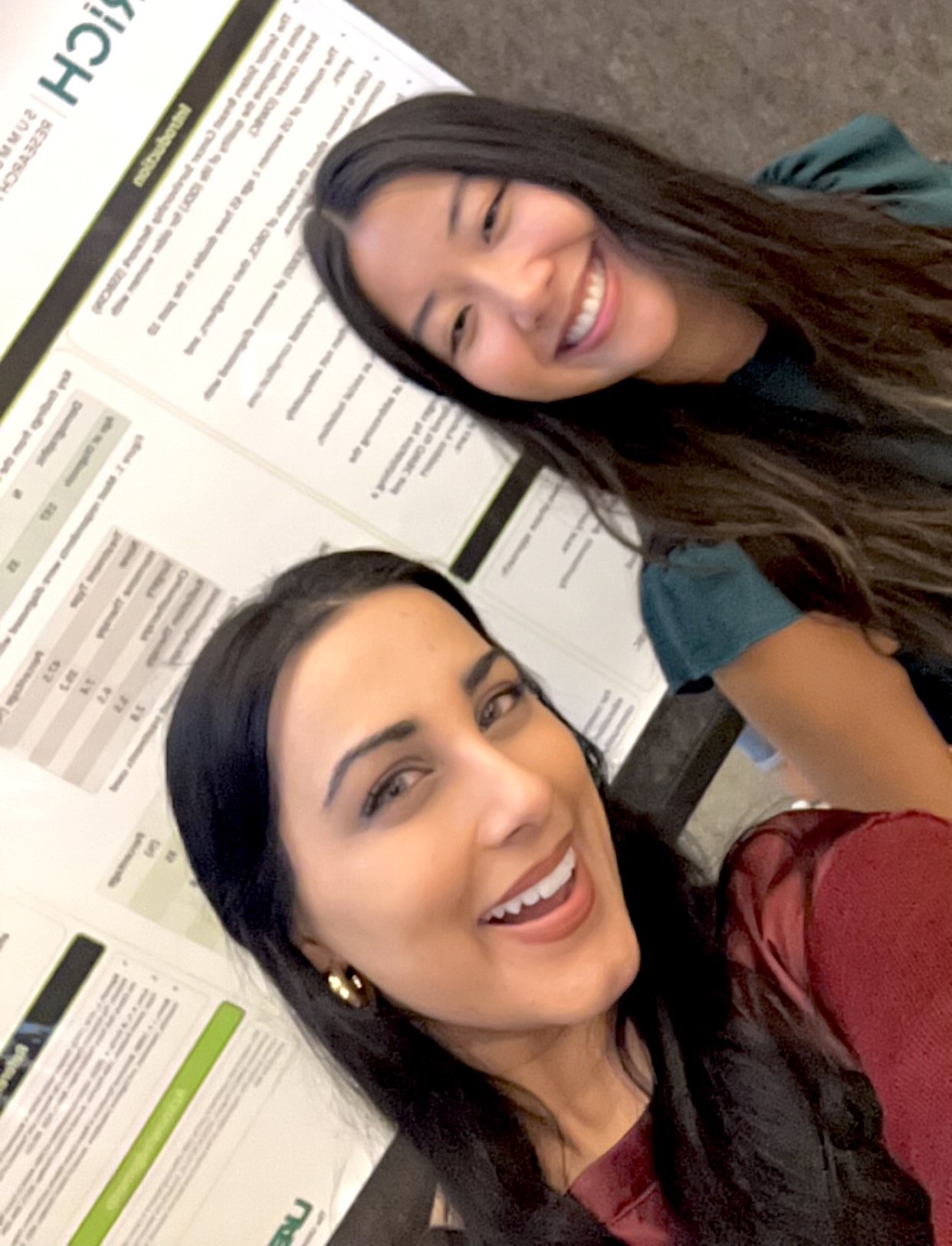 Myra Rana and Amy Trinh at UAB ENRICH symposium with her poster presentation.