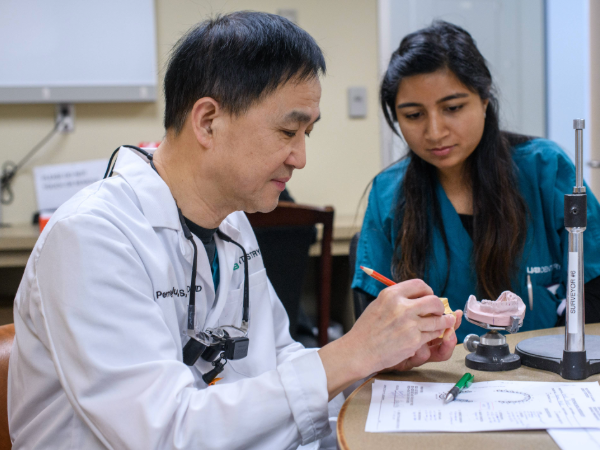 Dr. Liu working with studentresident