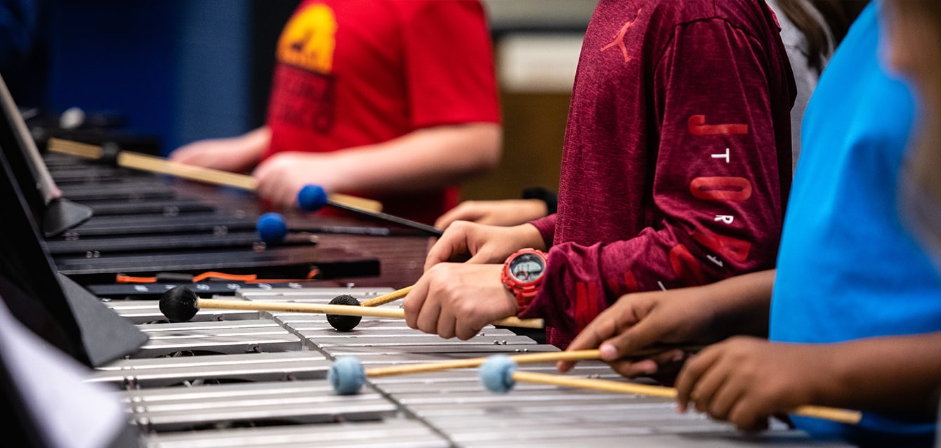 A conductor in a classroom setting. 