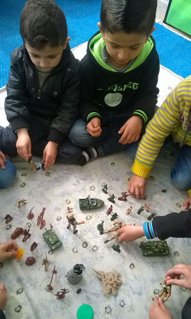 Students with Toy Army Figures