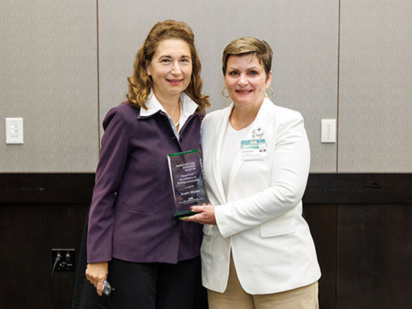 Anath Shalev, winner of the Excellence in Entrepreneurship Award, with Kathy Nugent, HIIE Director