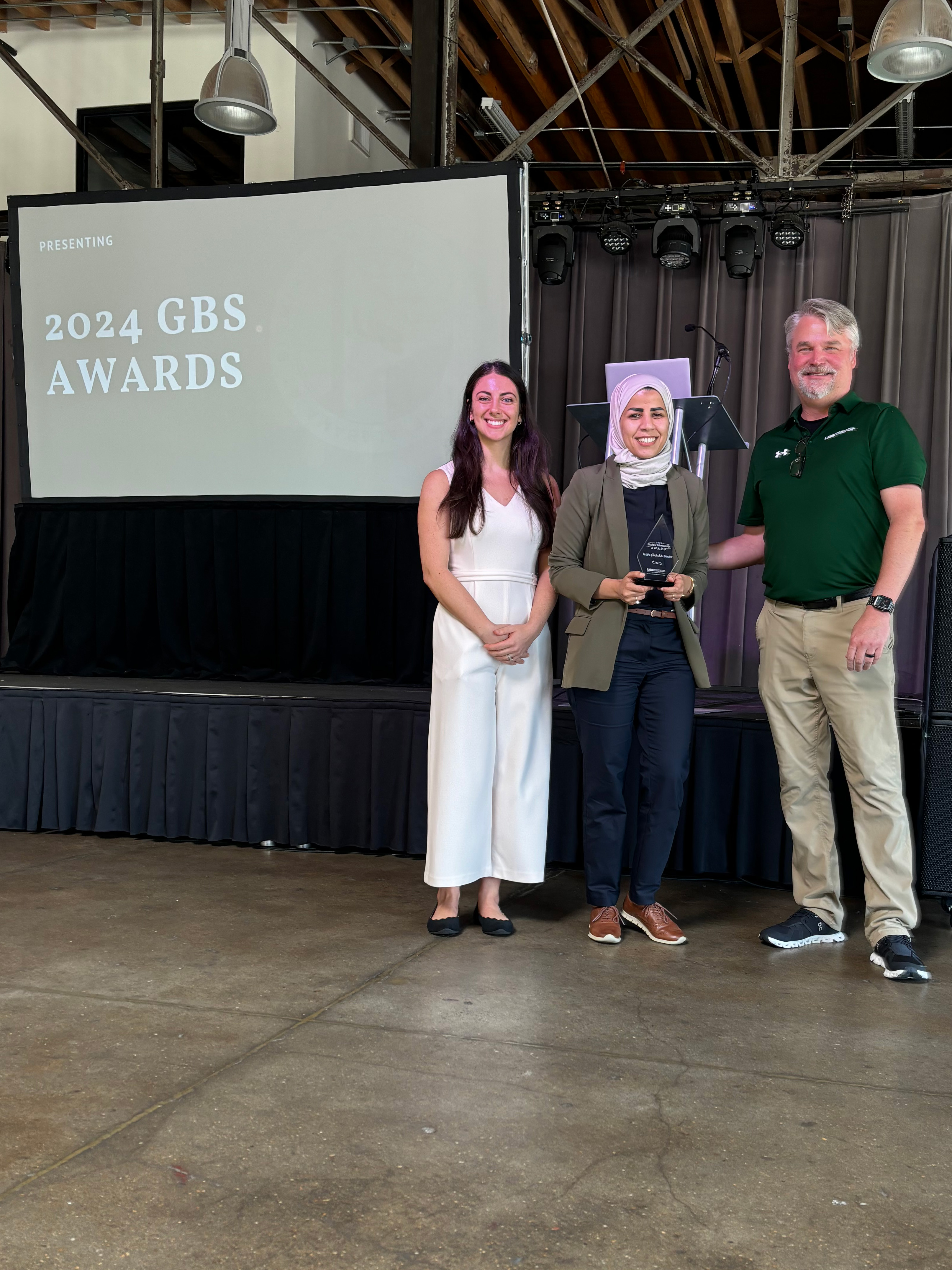 Alsharif receiving award