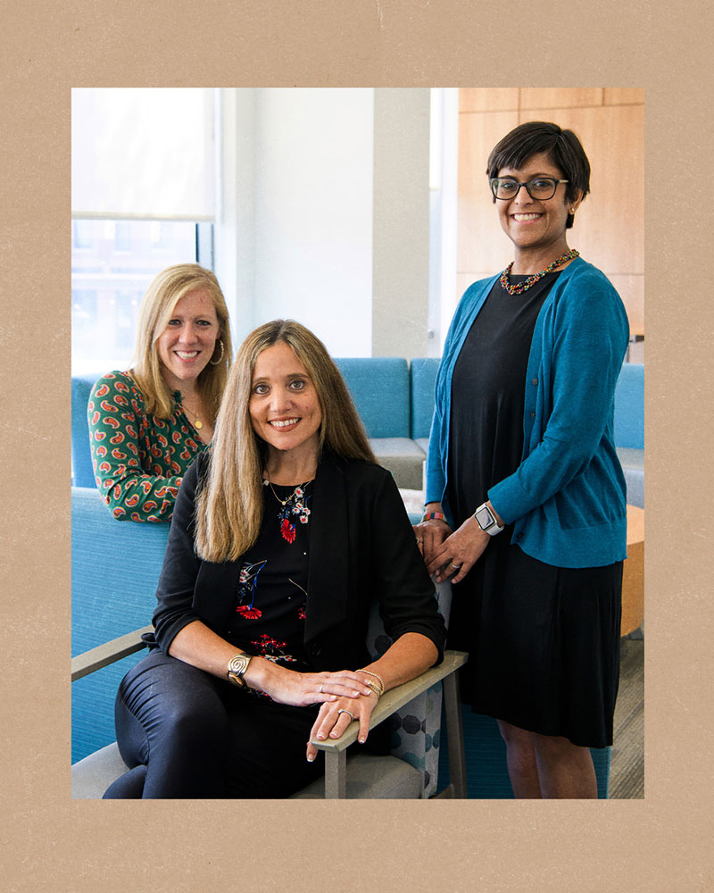 Carlie Stein Somerville, M.D., Betsy Hopson, and Snehal Khatri, M.D., pose in a group portrait in the waiting area of the UAB Staging Transition for Every Patient (STEP) clinic.