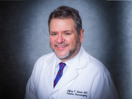Jeffrey P. Blount in a white doctor's coat