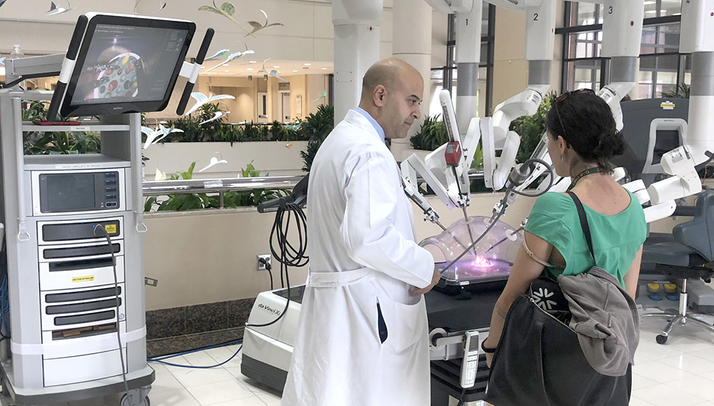 Dr. Abhisek Parmar discusses hernia care with passersby at a community education event in honor of National Hernia Awareness Month on June 4 in the second-floor atrium at North Pavilion. (Photo by Ashton Cook)