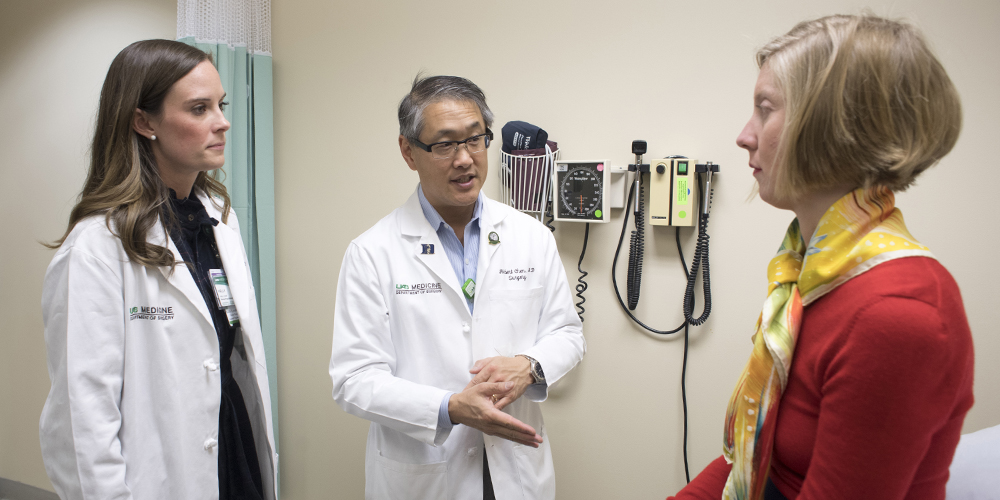 UAB Department of Surgery Chair Dr. Herbert Chen and nurse practitioner Kelly Lovell speak to a thyroid patient at The Kirklin Clinic. Chen and Lovell will soon both treat patients as part of the new UAB Multidisciplinary Endocrine Tumor Clinic.