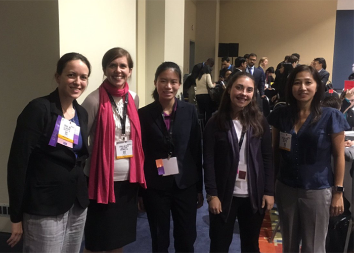 Michelle Chang, MS IV (center) with a group of medical students and a surgeon mentor during the medical student program at ACS.