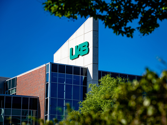 Detail of Hill Student Center fin and UAB signage with blue sky in the background, April 2020.