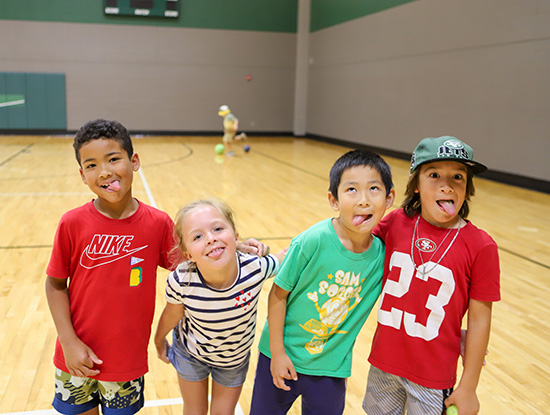 Children posing in a UAB Recreation Center court