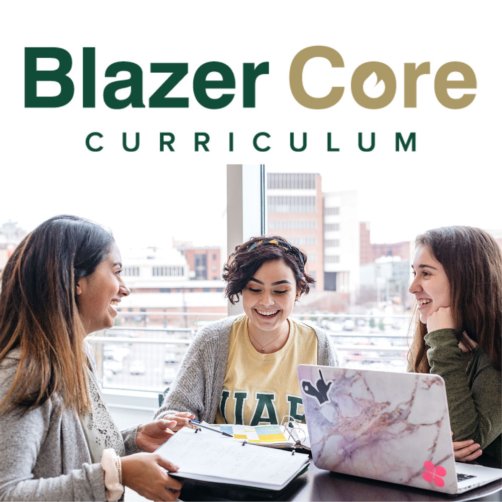 Three female students sitting around a small table with binders and a laptop, in front of a window. 