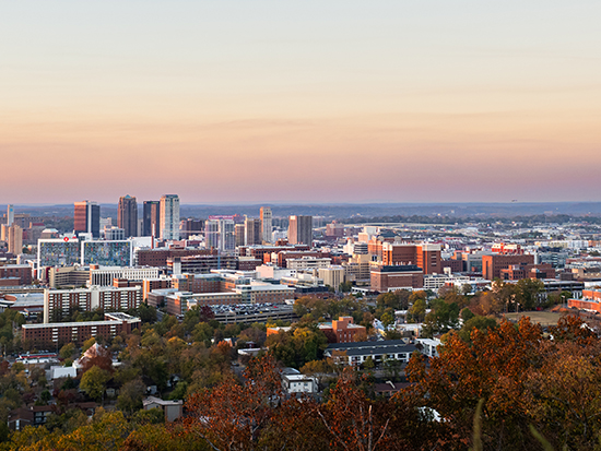 Aerial view of UAB campus and Birmingham skyline at sunset taken from Red Mountain