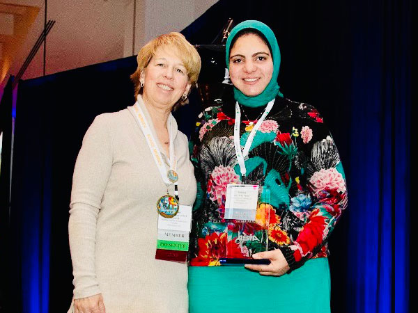 Dr. Salma Aly and another conference attendee.