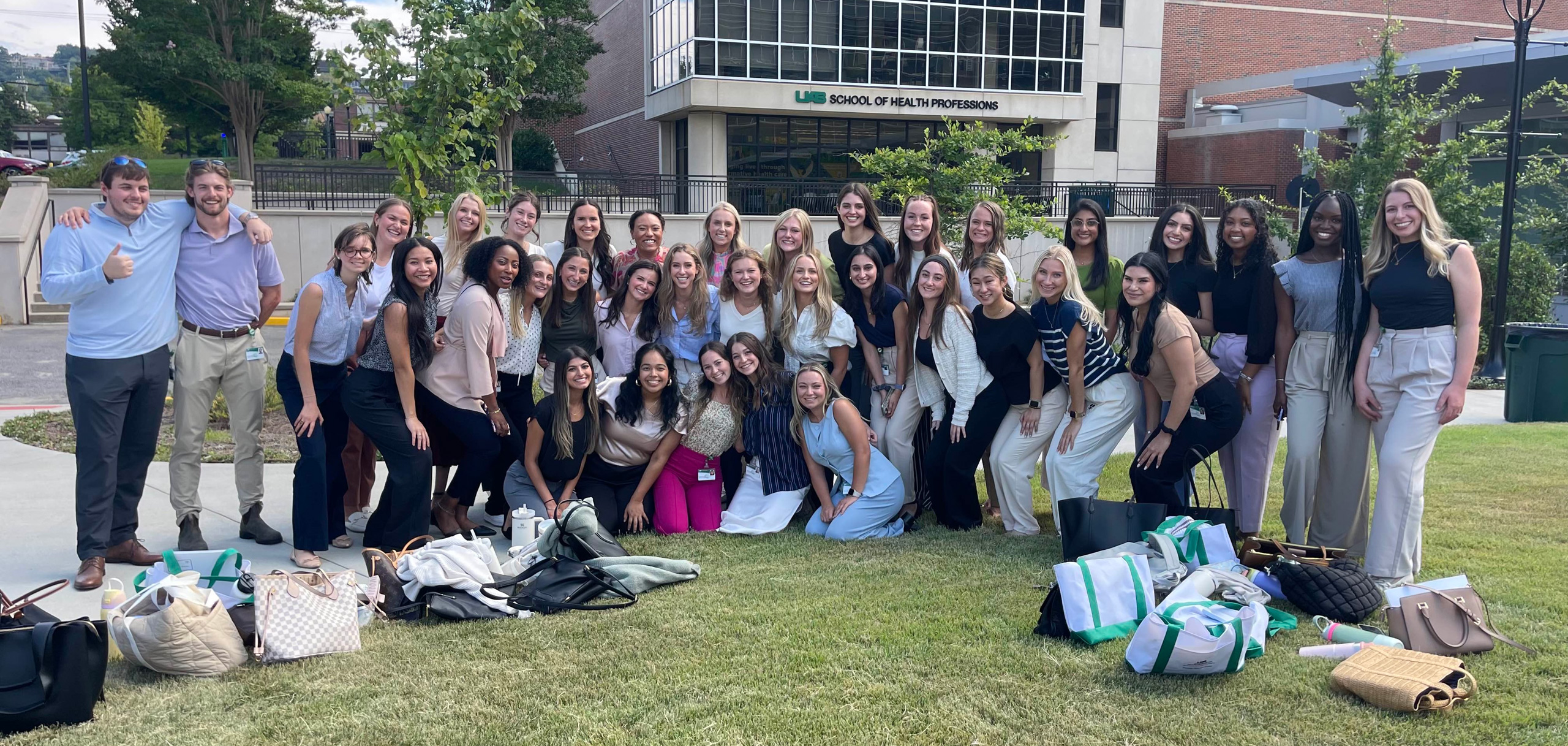 Eleanor Williams and Cacia Billings pictured with their cohort outside of the UAB School of Health Professions building.