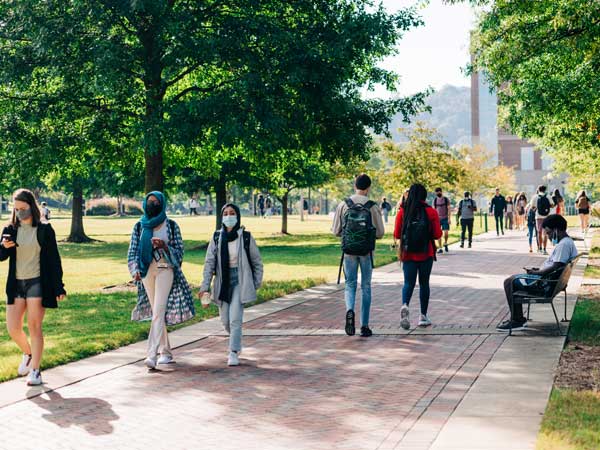 Students walking in campus green