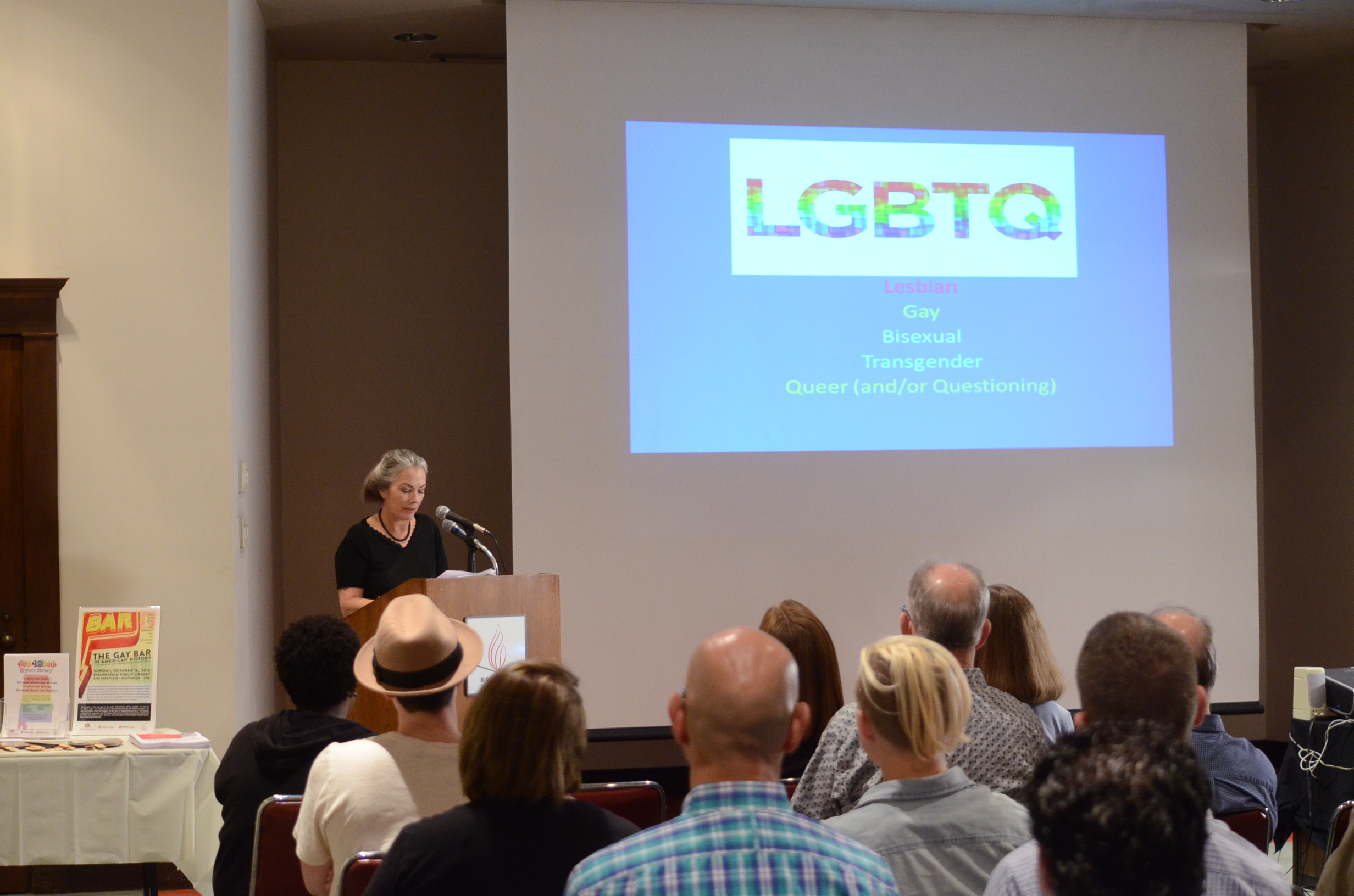  Caption: Nancy Unger speaks to a crowd at the Birmingham Public Library about LGBTQ roles in history. Photo by Ian Keel