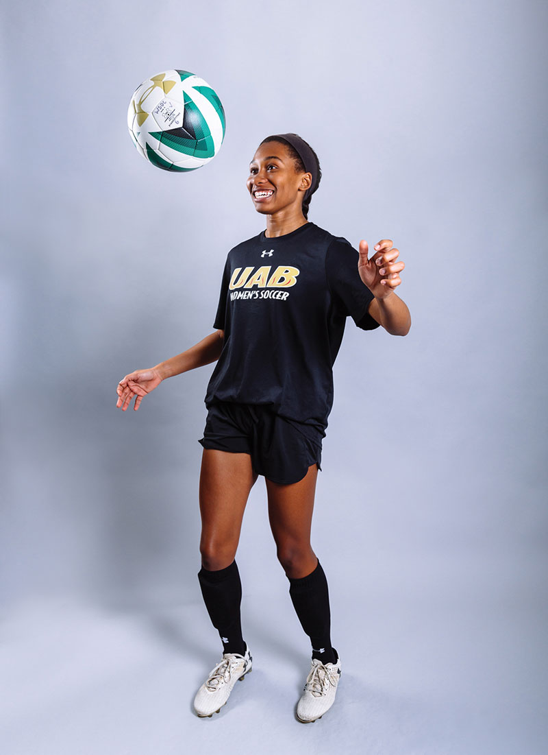 Photo of student Audria Wood bouncing soccer ball