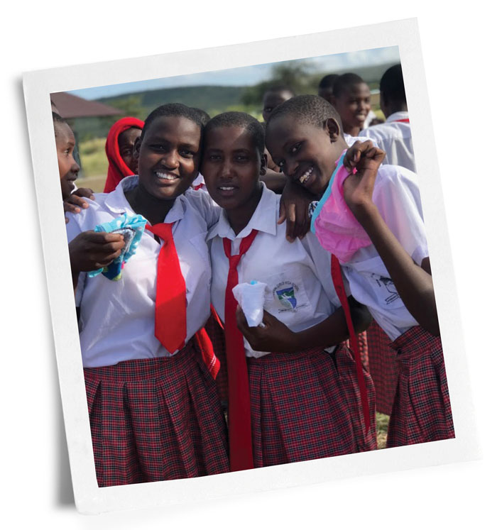 Photo of Kenyan girls with donated sanitary supplies