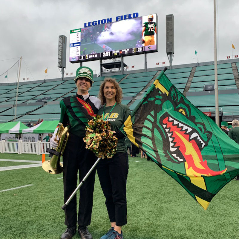 Photo of current band member Gabriel Clayton with his mother, Connie Clayton, at Legion Field