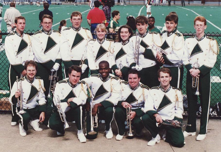 Photo of Jeremy McFall and other early band members in uniform at Legion Field in 1994