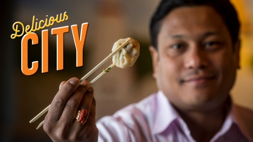Photo of Chef Abhi Sainju holding one of his Nepalese dumplings; title: Delicious City